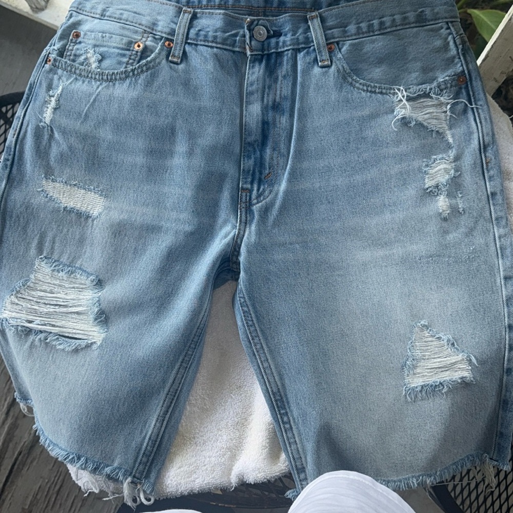 Men Levi’s 511 slim cutoff shorts.